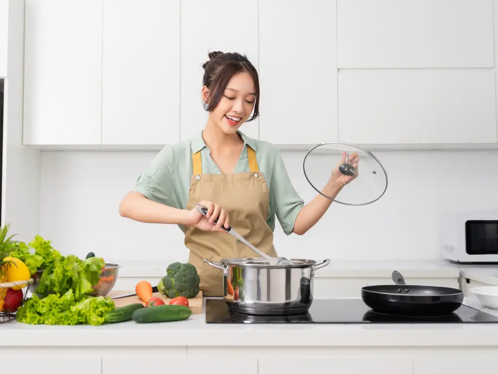 Woman cooking in kitchen